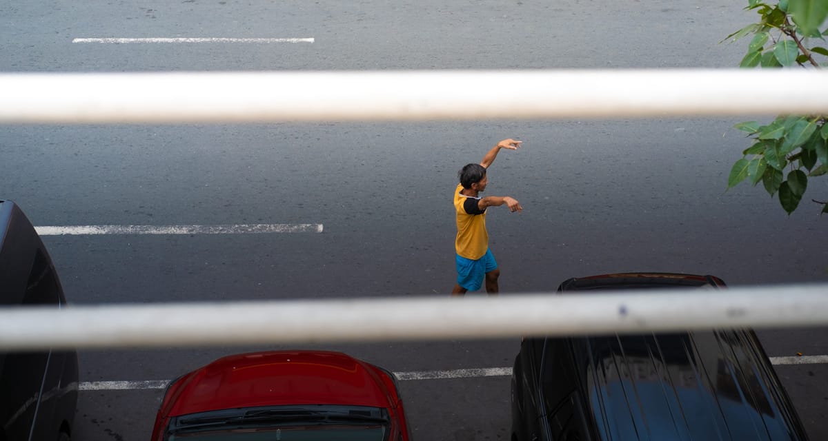 In this quiet corner, life happens softly. A fleeting pause in the rhythm of a bustling city where stories unfold in the most unassuming places.